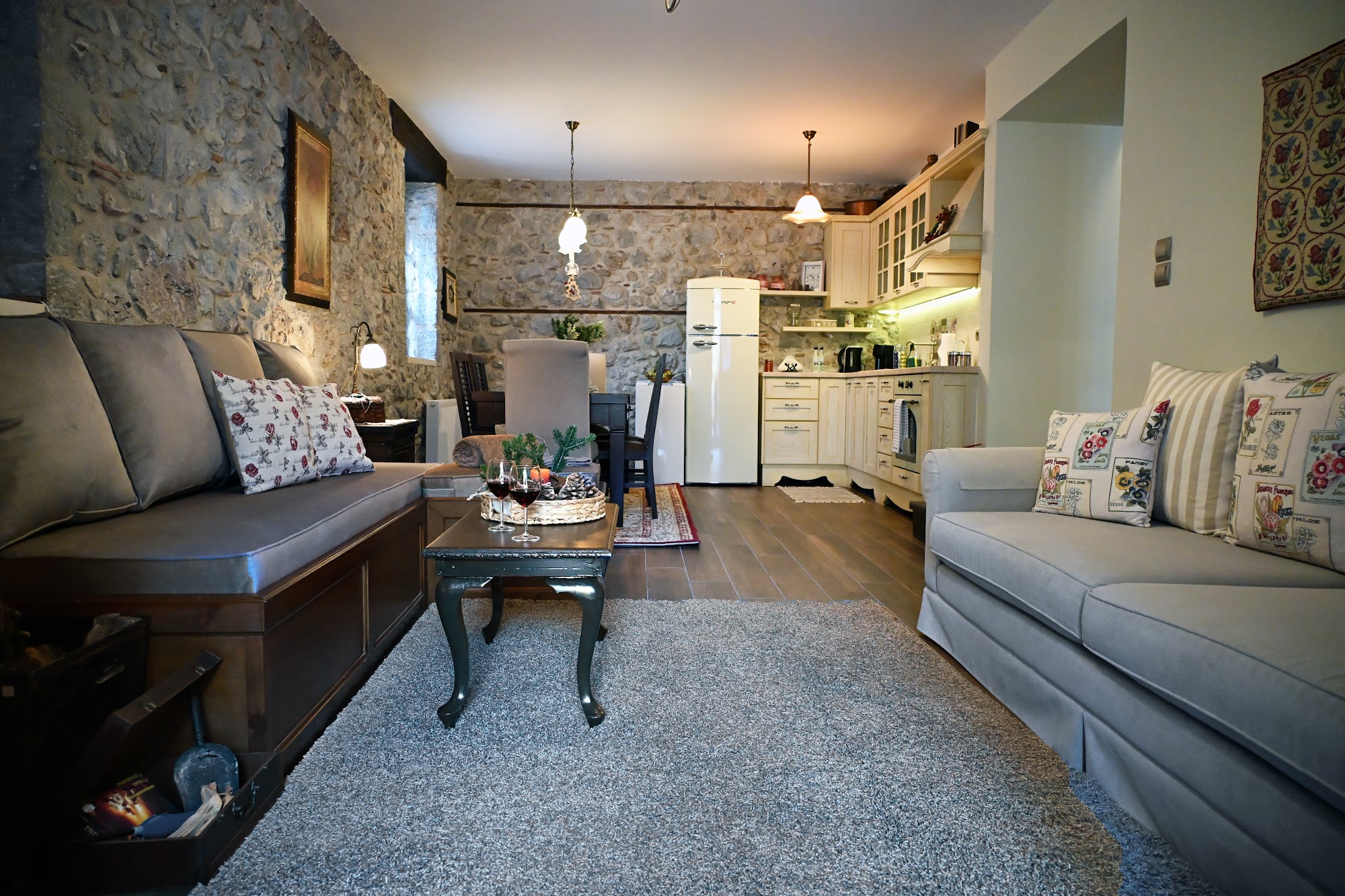 Open-plan living room with adjacent kitchen.