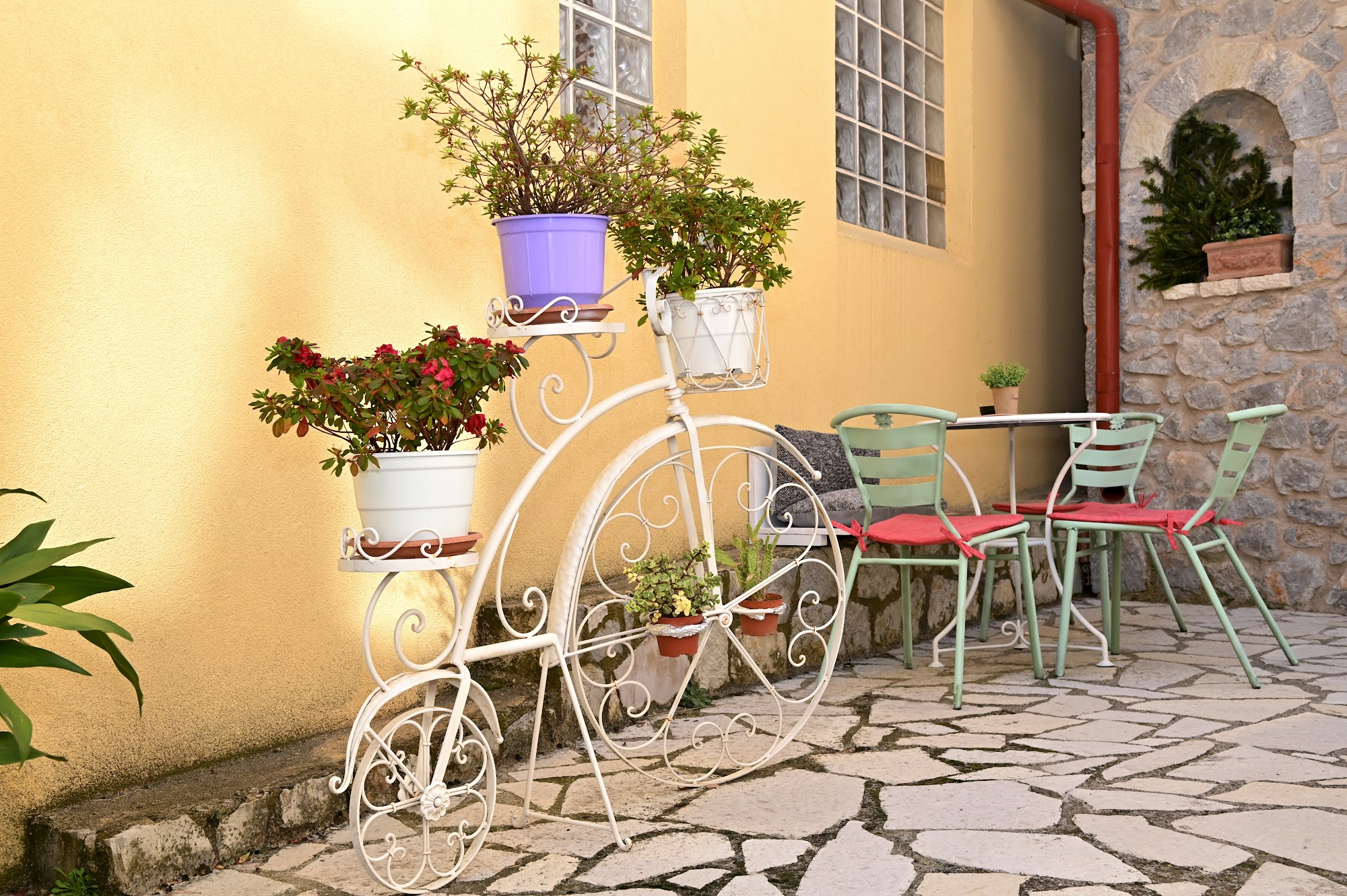 Outdoor seating with a bistro table in the courtyard.
